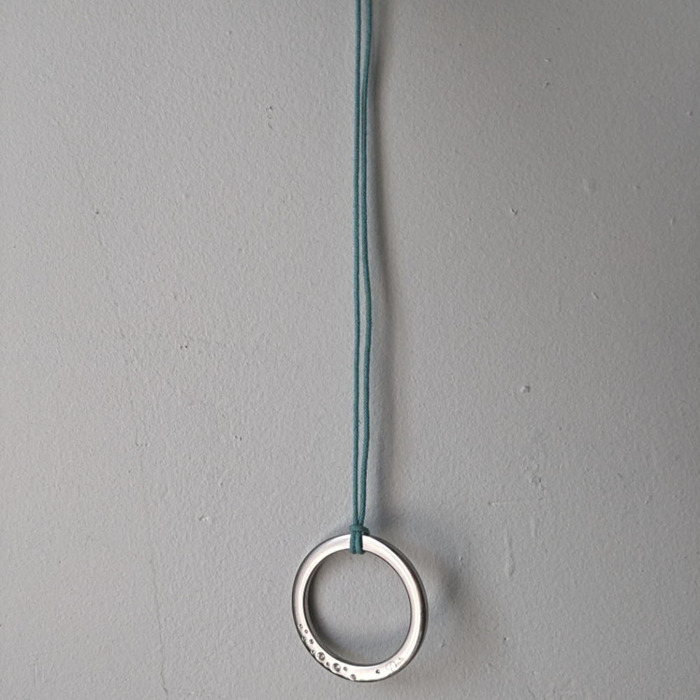 Details boho pendant with 11 brilliant cut stones made in Italy